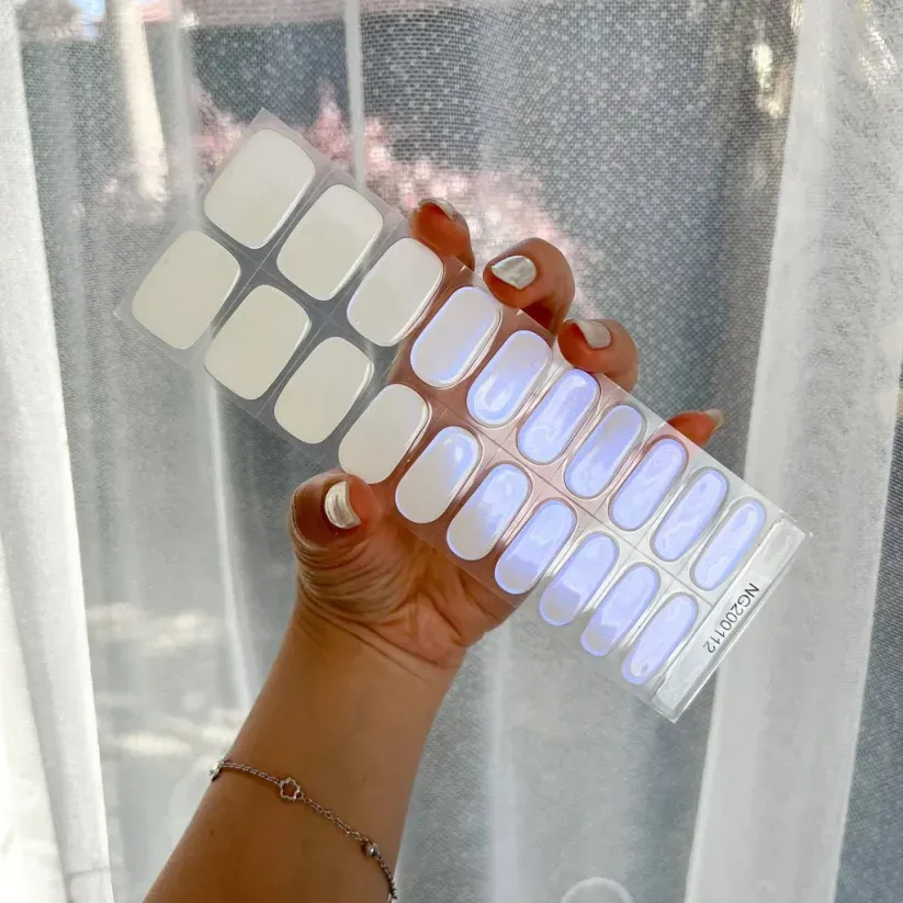 Iridescent Blue Glow Gel Nail Wraps featuring a shimmering blue finish for a dazzling DIY manicure.