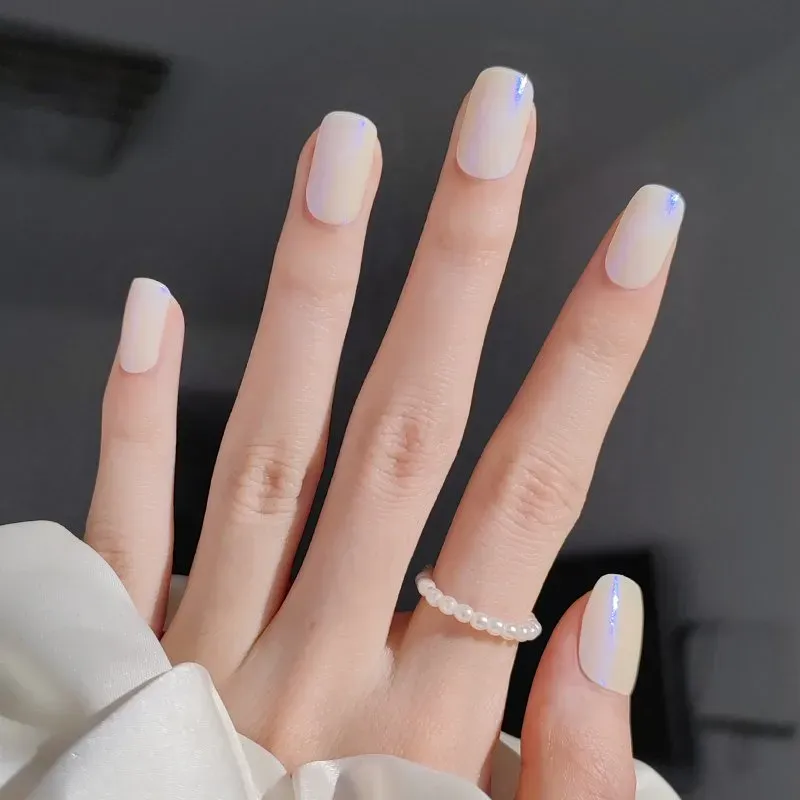 Iridescent Blue Glow Gel Nail Wraps featuring a shimmering blue finish for a dazzling DIY manicure.