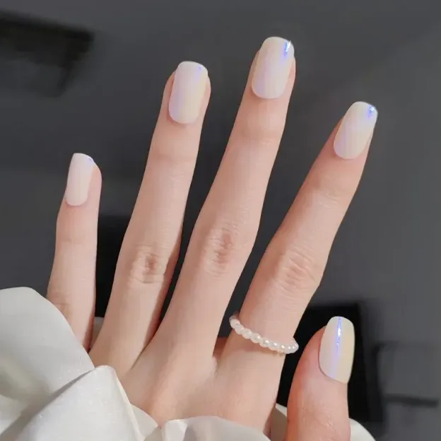 Iridescent Blue Glow Gel Nail Wraps featuring a shimmering blue finish for a dazzling DIY manicure.