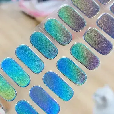 Iridescent Glow Gel Nail Wraps featuring a mesmerizing holographic design for a bold and unique manicure.