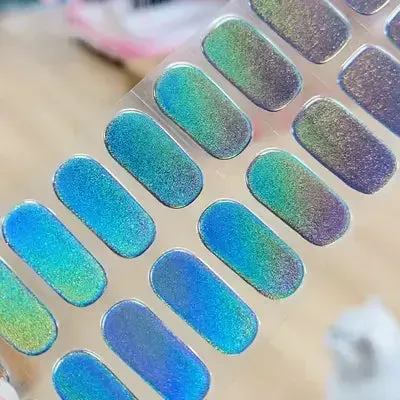 Iridescent Glow Gel Nail Wraps featuring a mesmerizing holographic design for a bold and unique manicure.