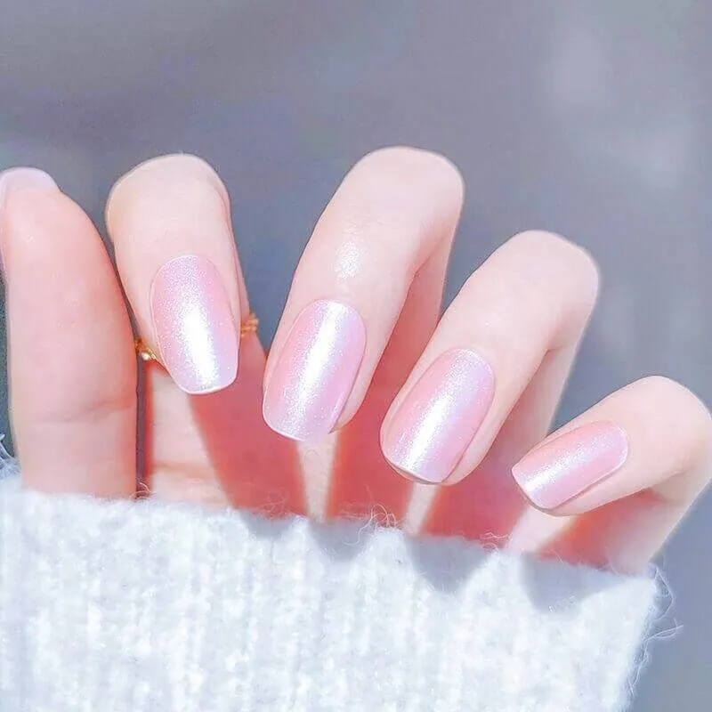 Iridescent pink pearl gel nail wraps with a subtle shimmer and elegant finish.