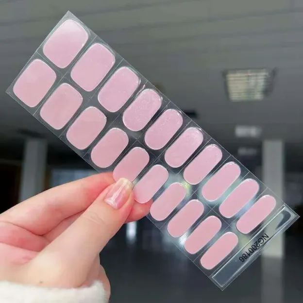 Iridescent pink pearl gel nail wraps with a subtle shimmer and elegant finish.