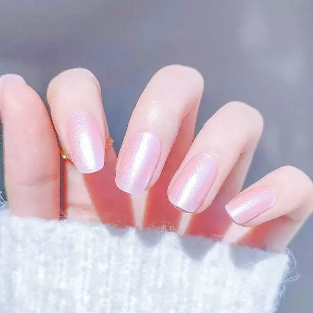 Iridescent pink pearl gel nail wraps with a subtle shimmer and elegant finish.