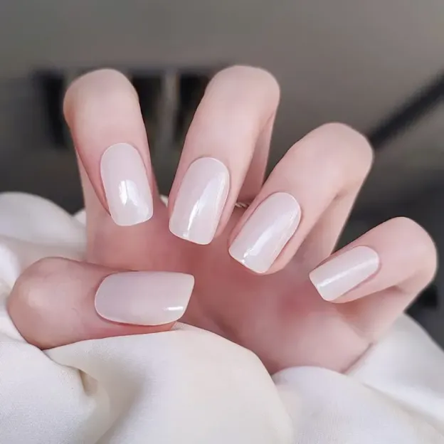 Ivory Elegance Gel Nail Wraps with a soft shimmer finish for a sophisticated manicure.