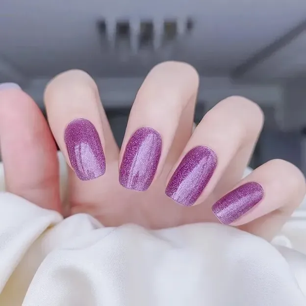 Lavender Glow Gel Nail Wraps featuring a glittering lavender finish, perfect for an elegant manicure.