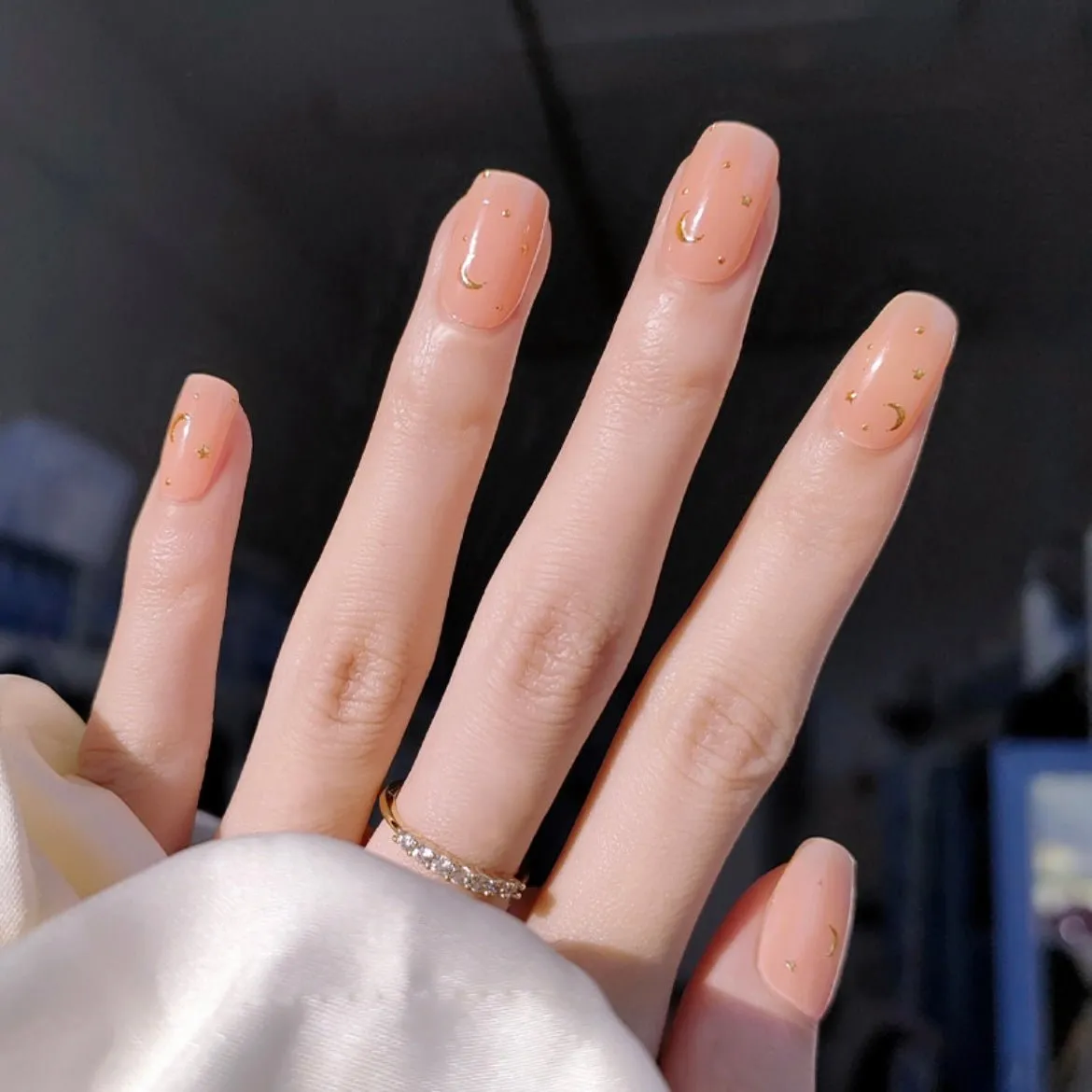 Little Venus Gel Nail Wraps featuring a celestial moon and star design in golden accents for semi-cured gel nails.