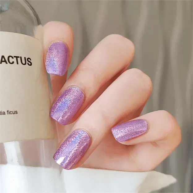Luminous Lavender Gel Nail Wraps with shimmering purple glitter for an elegant manicure.