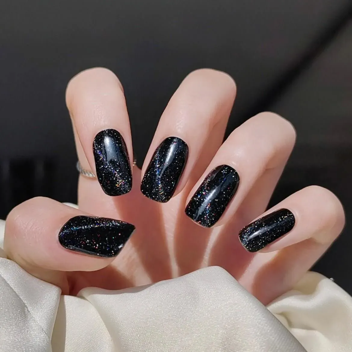 Midnight Glitter Gel Nail Wraps featuring a glossy black design with sparkling glitter, perfect for an elegant and bold manicure.