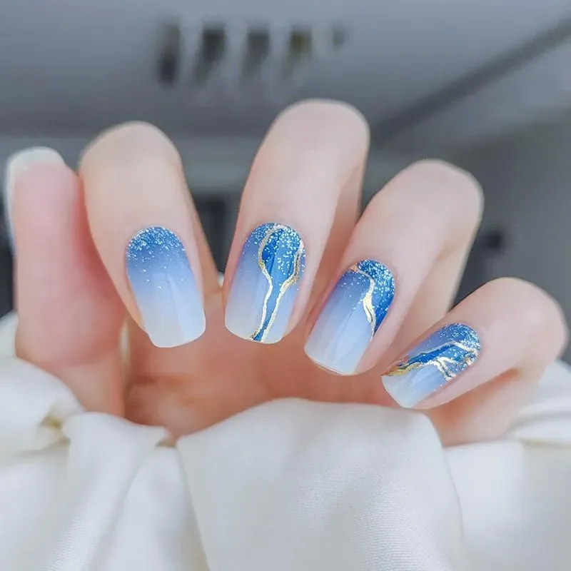 Midnight Wave Gel Nail Wraps featuring blue ombre and glitter for elegant evening nail designs.