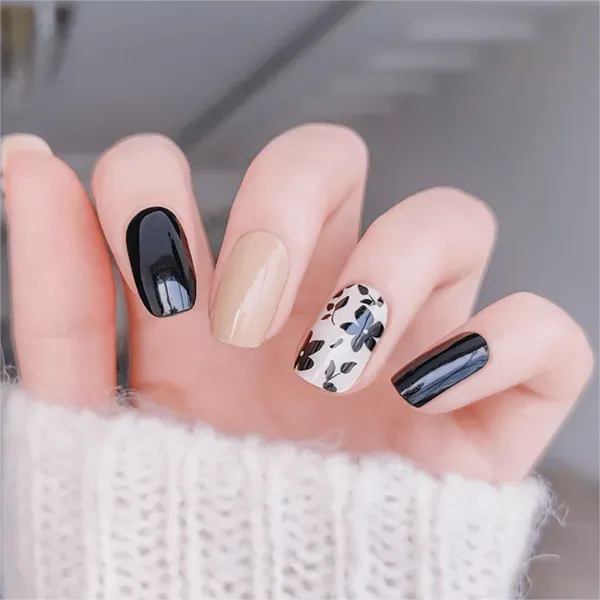 Modern Chic Gel Nail Wraps featuring black and beige tones with abstract floral designs for an elegant manicure.