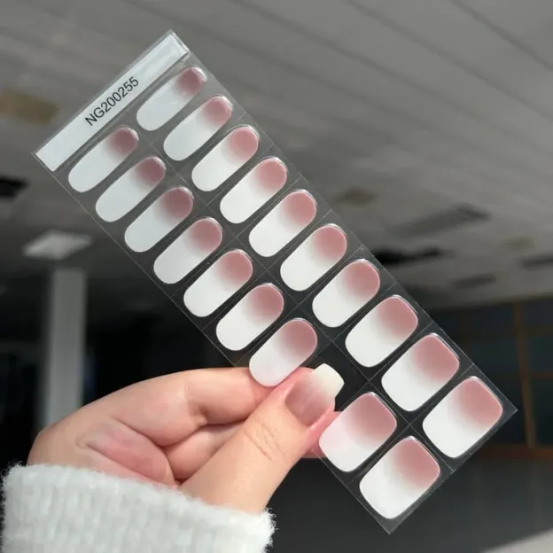Pink ombre French gel nail wraps featuring a subtle gradient for a natural and elegant manicure.