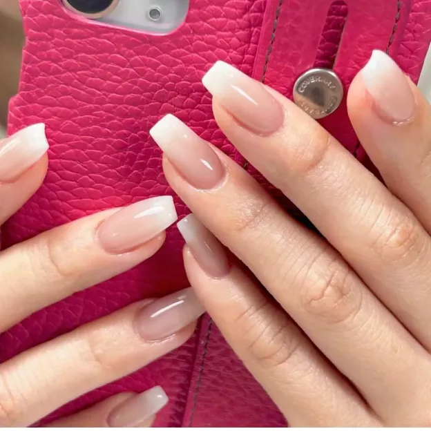 Pink ombre French gel nail wraps featuring a subtle gradient for a natural and elegant manicure.