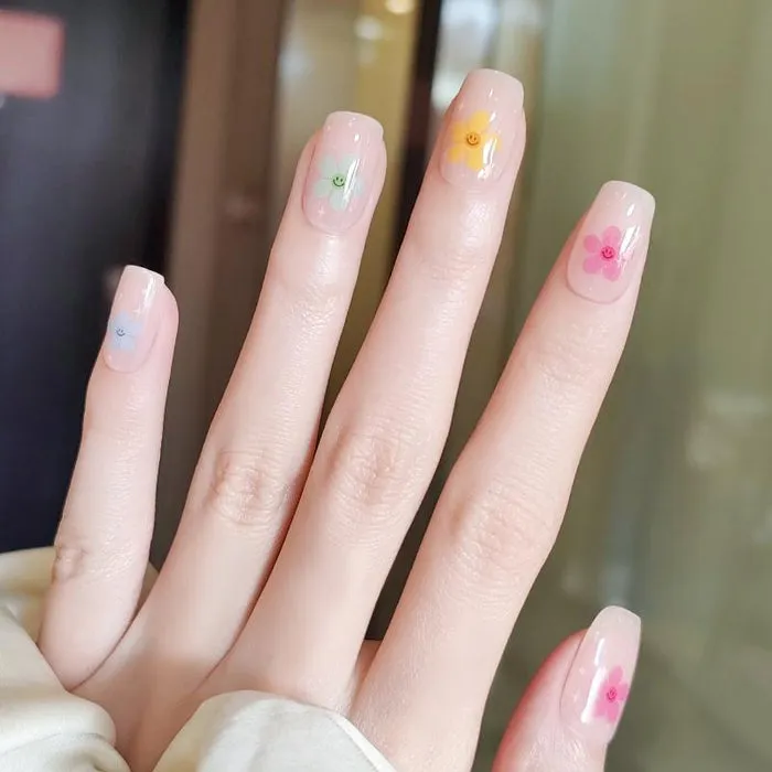 Playful Blossom Gel Nail Wraps with vibrant flower designs for cheerful spring nail art.