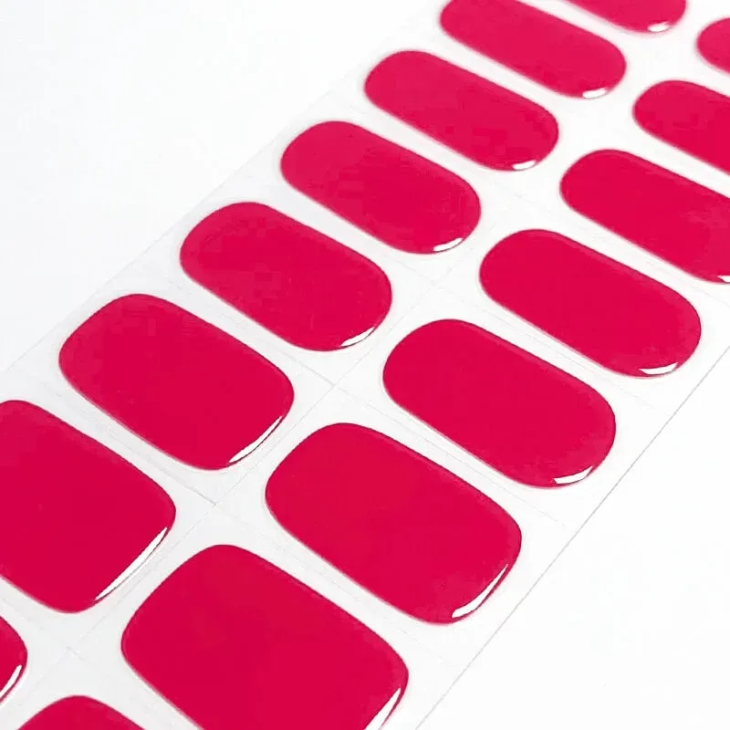 Radiant Ruby Gel Nail Wraps with a vibrant red glossy finish, offering a bold and elegant manicure at home.