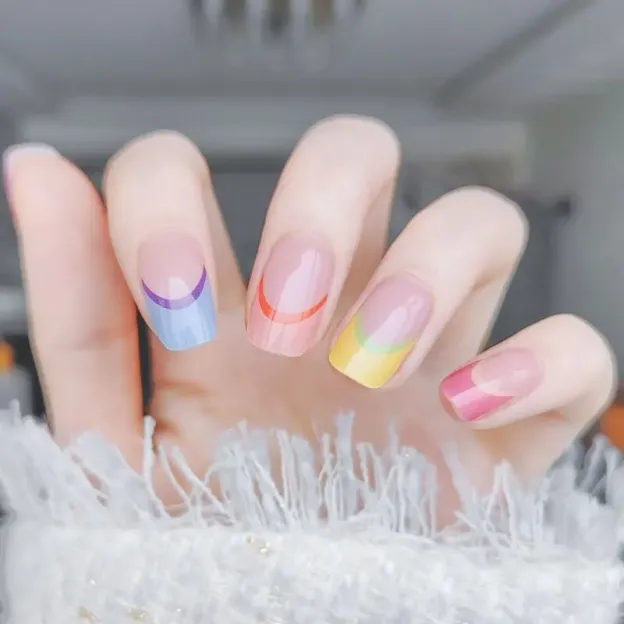 Rainbow French Tip Gel Nail Wraps featuring vibrant multi-colored tips for a playful manicure.
