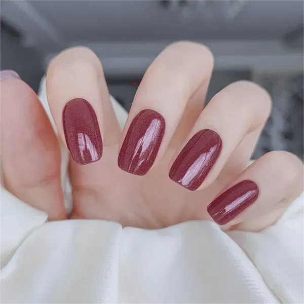 Ruby Glow Gel Nail Wraps with deep red shimmering tones for a bold, elegant manicure.