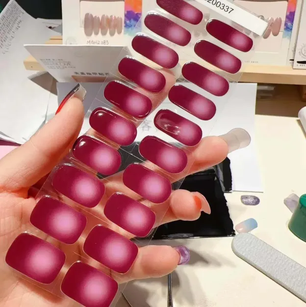 Ruby Ombre Gel Nail Wraps featuring a stunning red gradient design for a bold and sophisticated manicure.