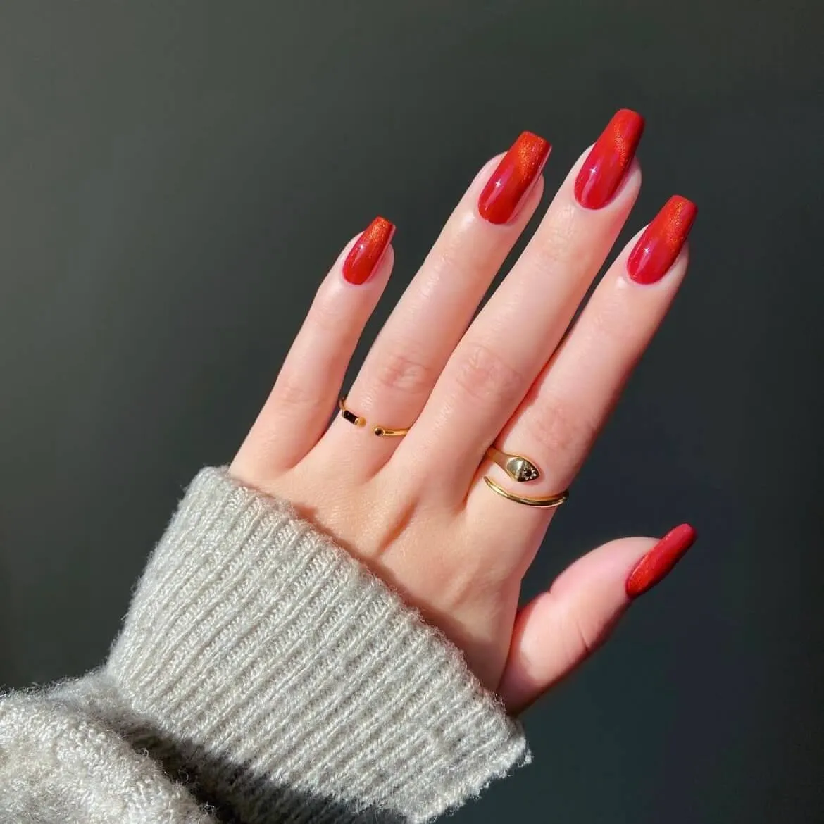 Shimmer red gel nail wraps with a glossy and sparkly finish for an elegant DIY nail art look.