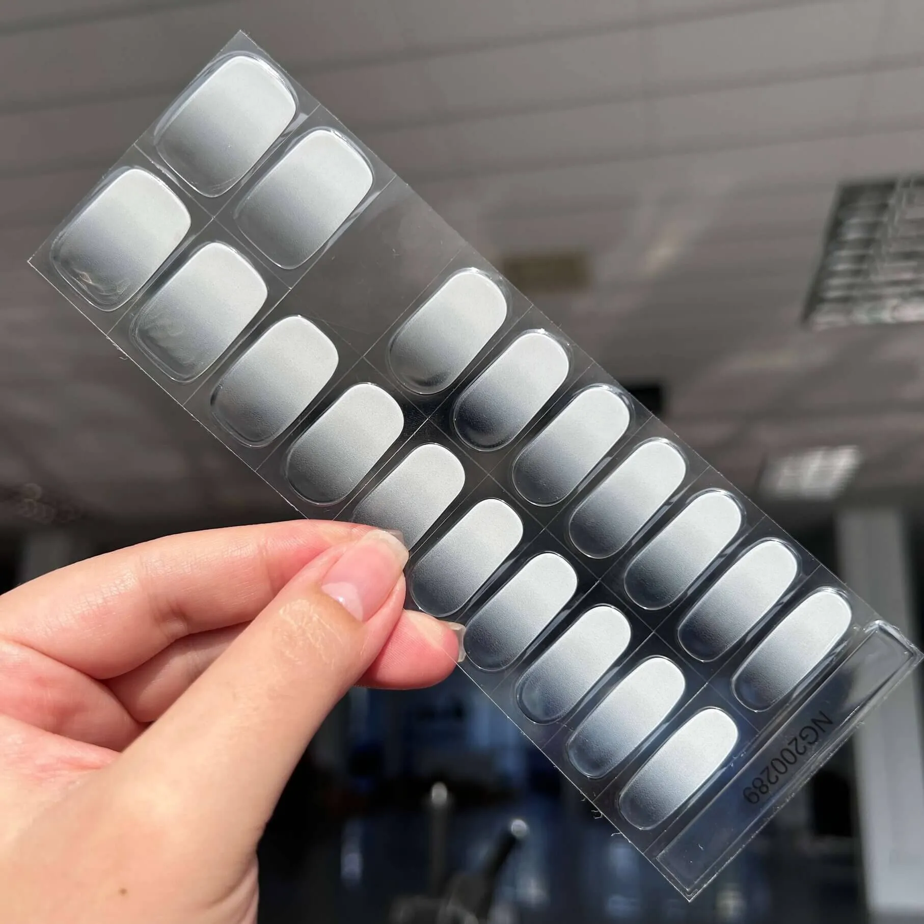 Silver gradient gel nail wraps with a metallic ombre finish, perfect for a chic and elegant manicure.
