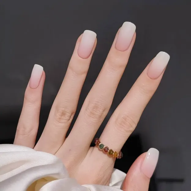 Soft Gradient Elegance Gel Nail Wraps showcasing a nude ombre design for a flawless manicure.