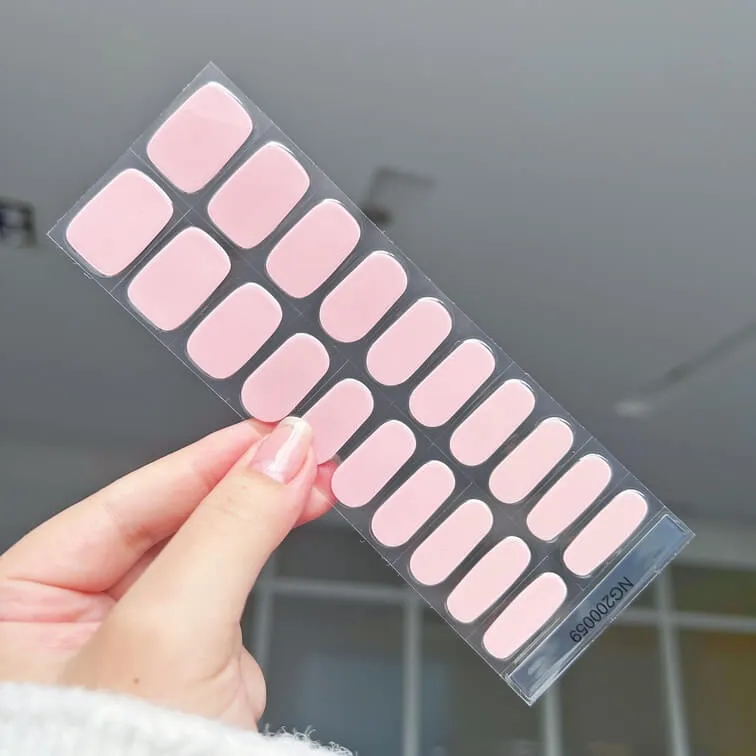 Soft pink gel nail wraps with a minimalist and natural finish, perfect for an elegant everyday look.