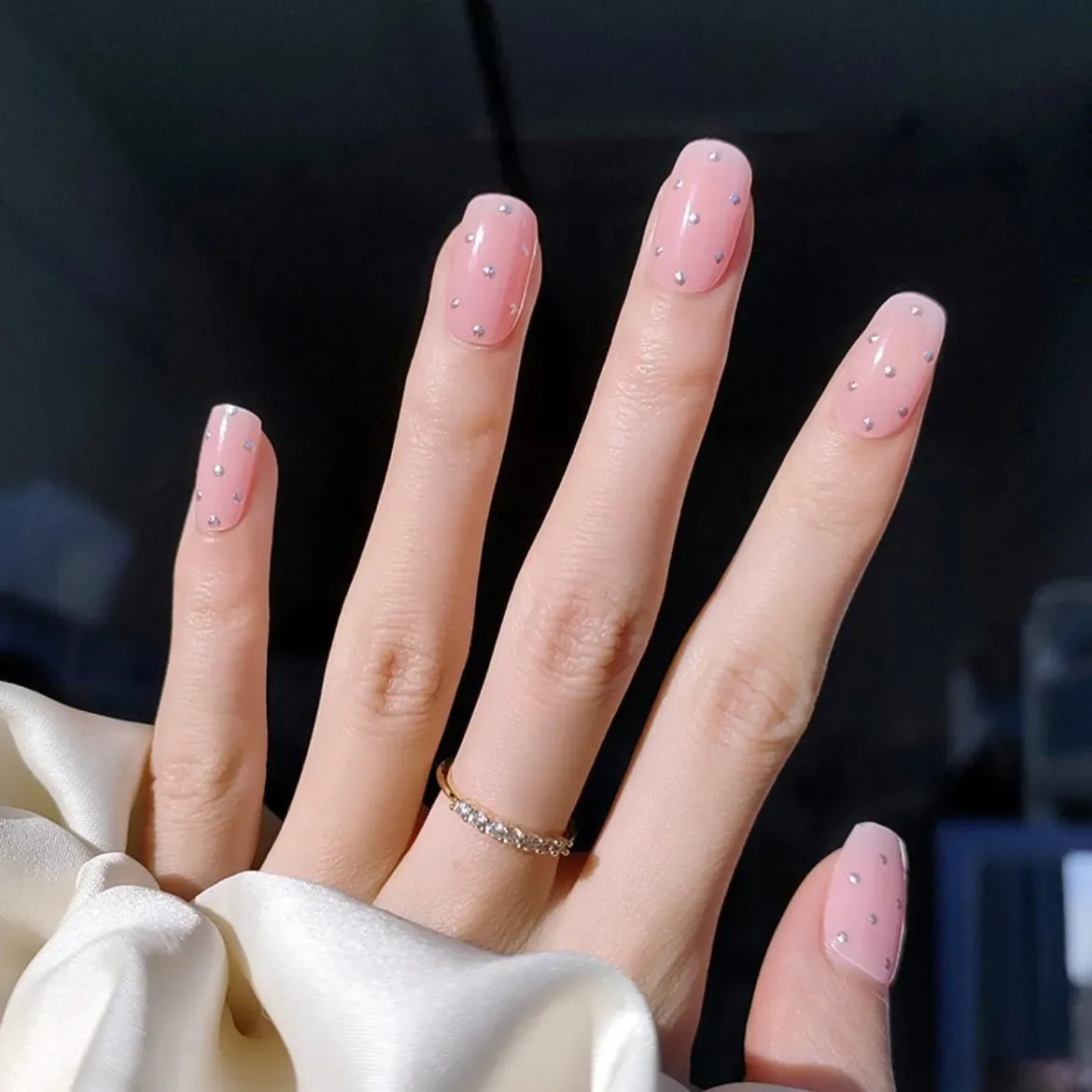 Sparkling Pink Studded Gel Nail Wraps featuring rhinestone embellishments on a glossy pink base for an elegant manicure.
