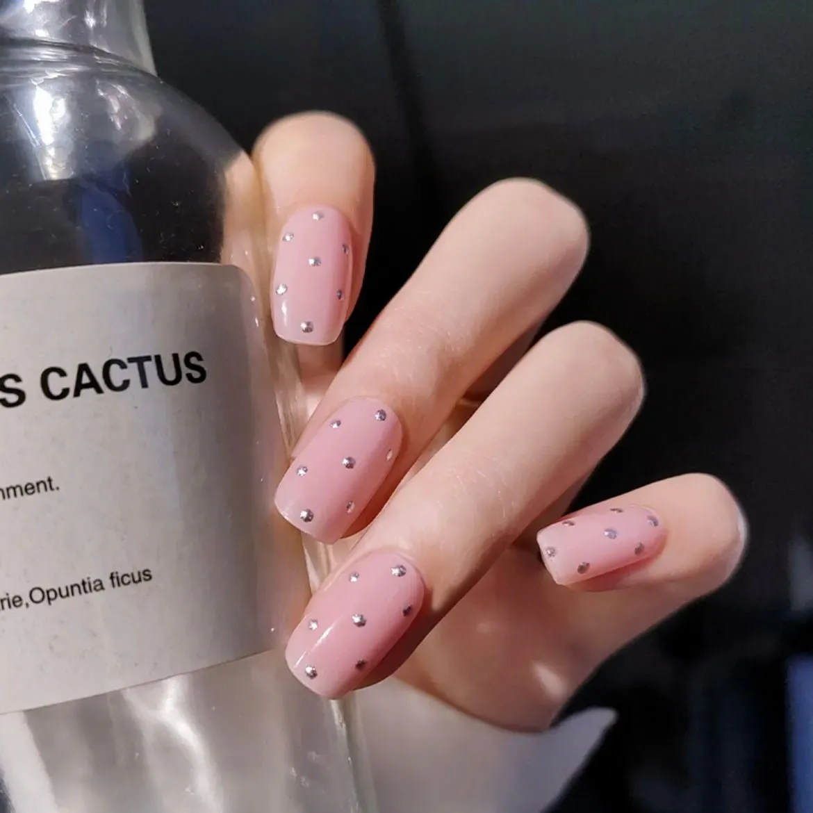 Sparkling Pink Studded Gel Nail Wraps featuring rhinestone embellishments on a glossy pink base for an elegant manicure.