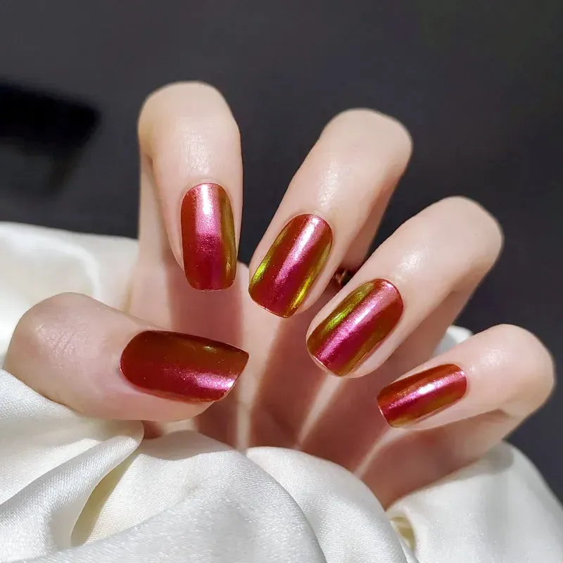 Sunset Mirage Gel Nail Wraps showcasing a radiant metallic gradient of red and gold for an elegant manicure.