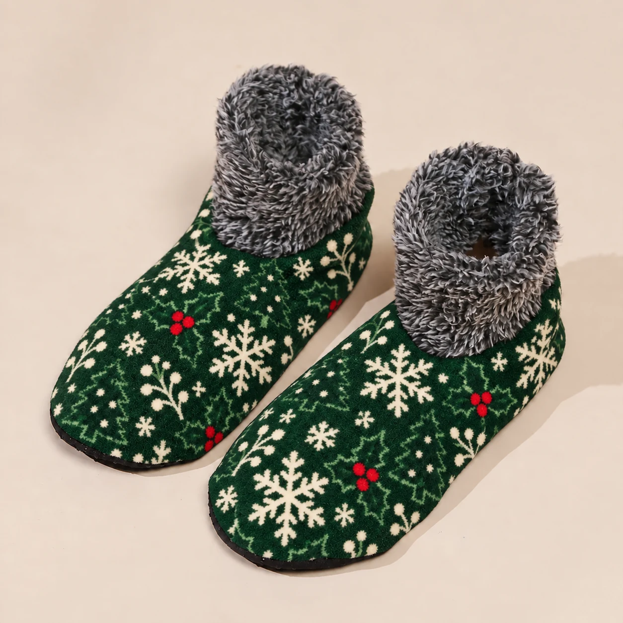 Green Christmas fuzzy house socks with white snowflake and red holly print