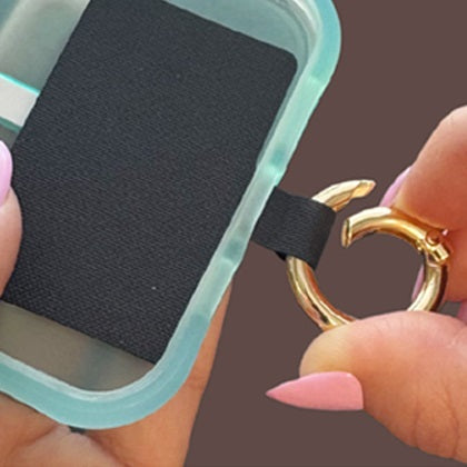 Step 2: Pass the open ring or clip through the tether tab