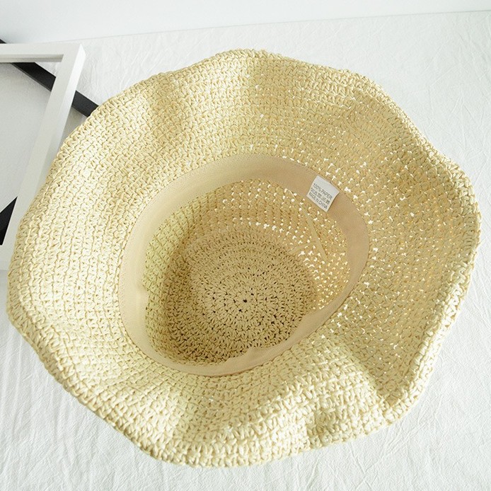 Straw Sun Hat With Wide Brim Round Crown and Natural Weave Texture Ideal for Coastal Styling
