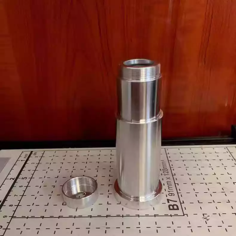 10X freely extendable lens for fiber lasers