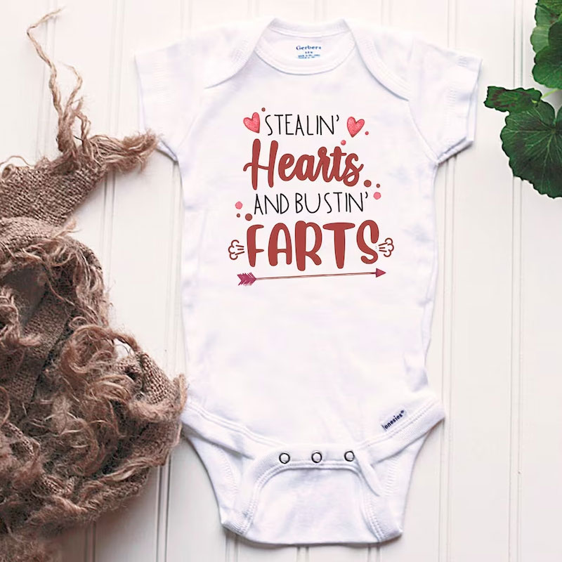 Stealin' Hearts and Bustin' Farts Baby Bodysuit