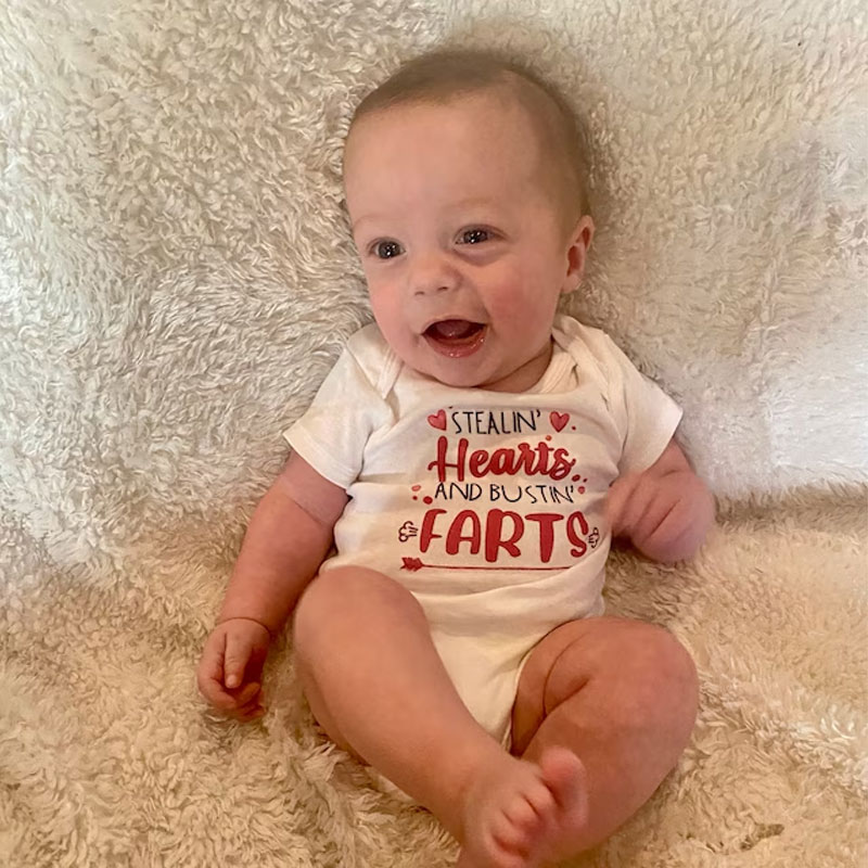 Stealin' Hearts and Bustin' Farts Baby Bodysuit