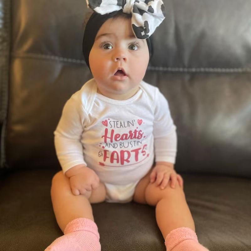Stealin' Hearts and Bustin' Farts Baby Bodysuit