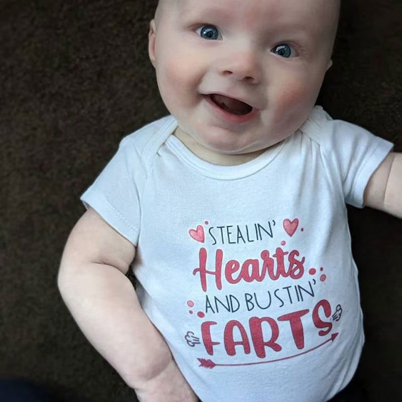 Stealin' Hearts and Bustin' Farts Baby Bodysuit
