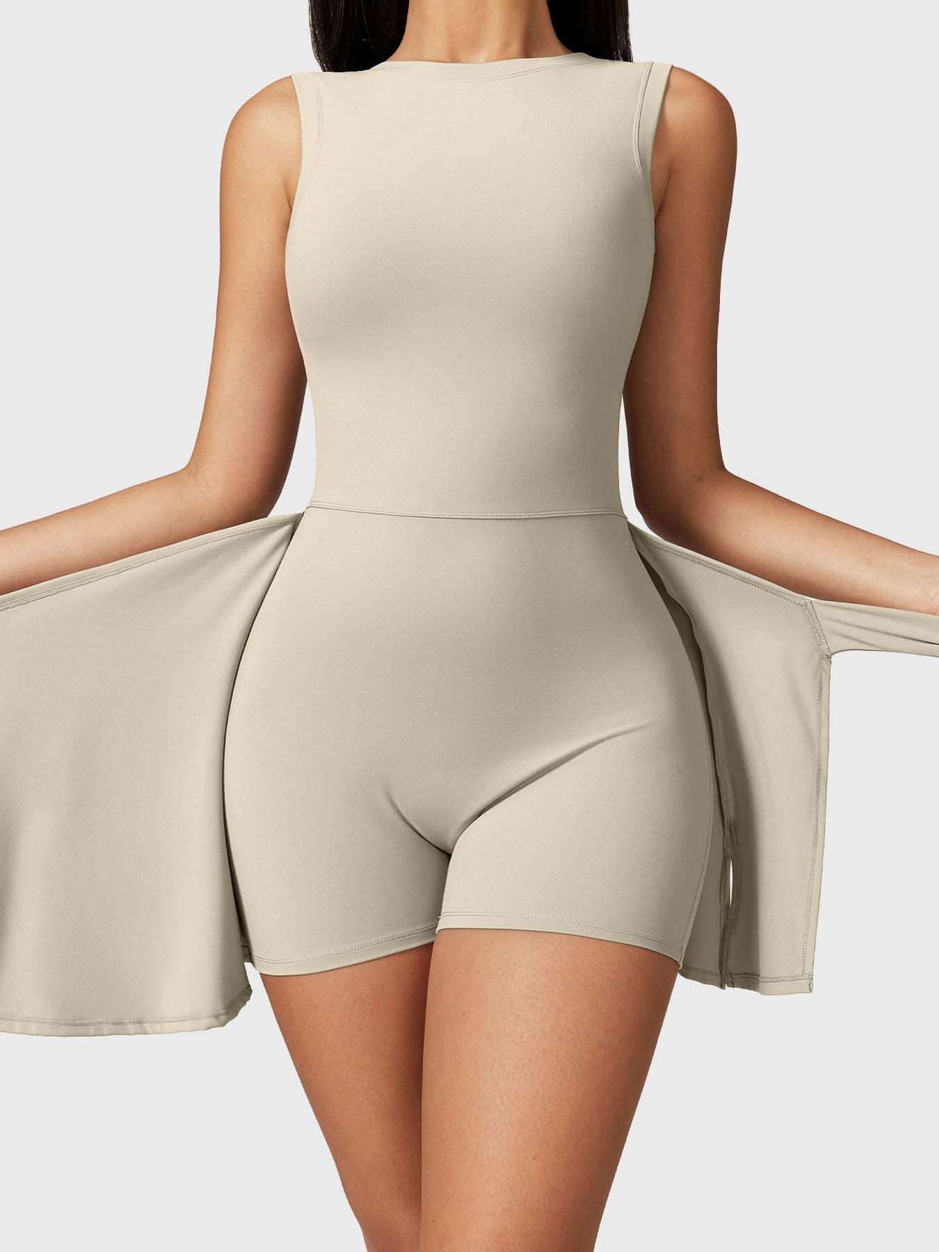 Front view of the Yeoreo Renee Sleeveless Tennis Dress in Light Khaki, showcasing customizable tie design