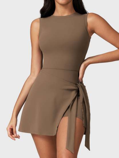 Front view of Yeoreo Renee Sleeveless Tennis Dress in Brown – boat neckline, tie waist design