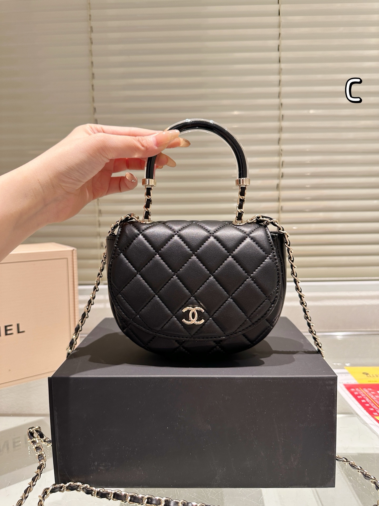 C style Black and gold chain handle bag