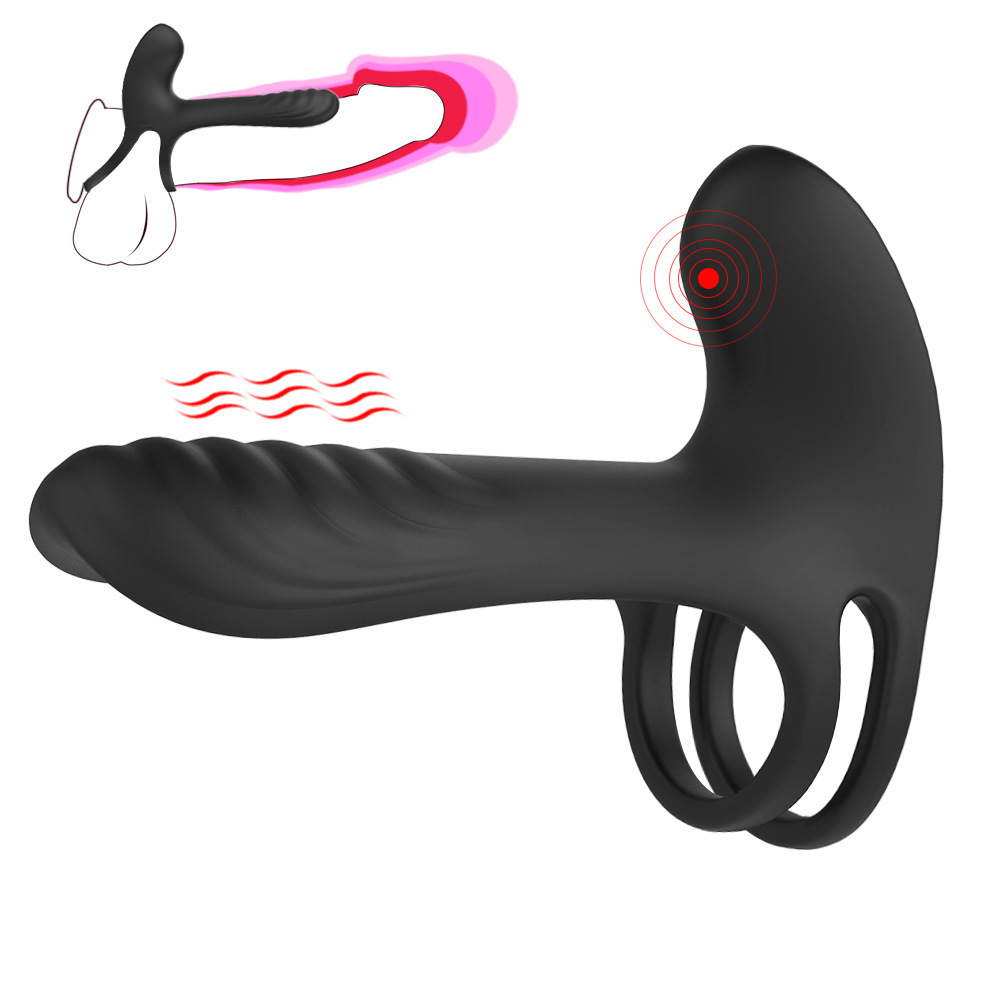 Vibrating cock sleeve with clit stimulator