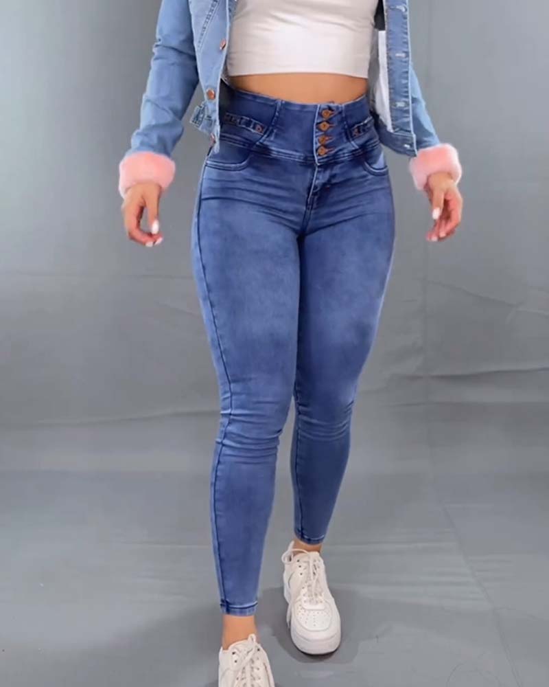 Jeans ajustados con talle alto y botonadura