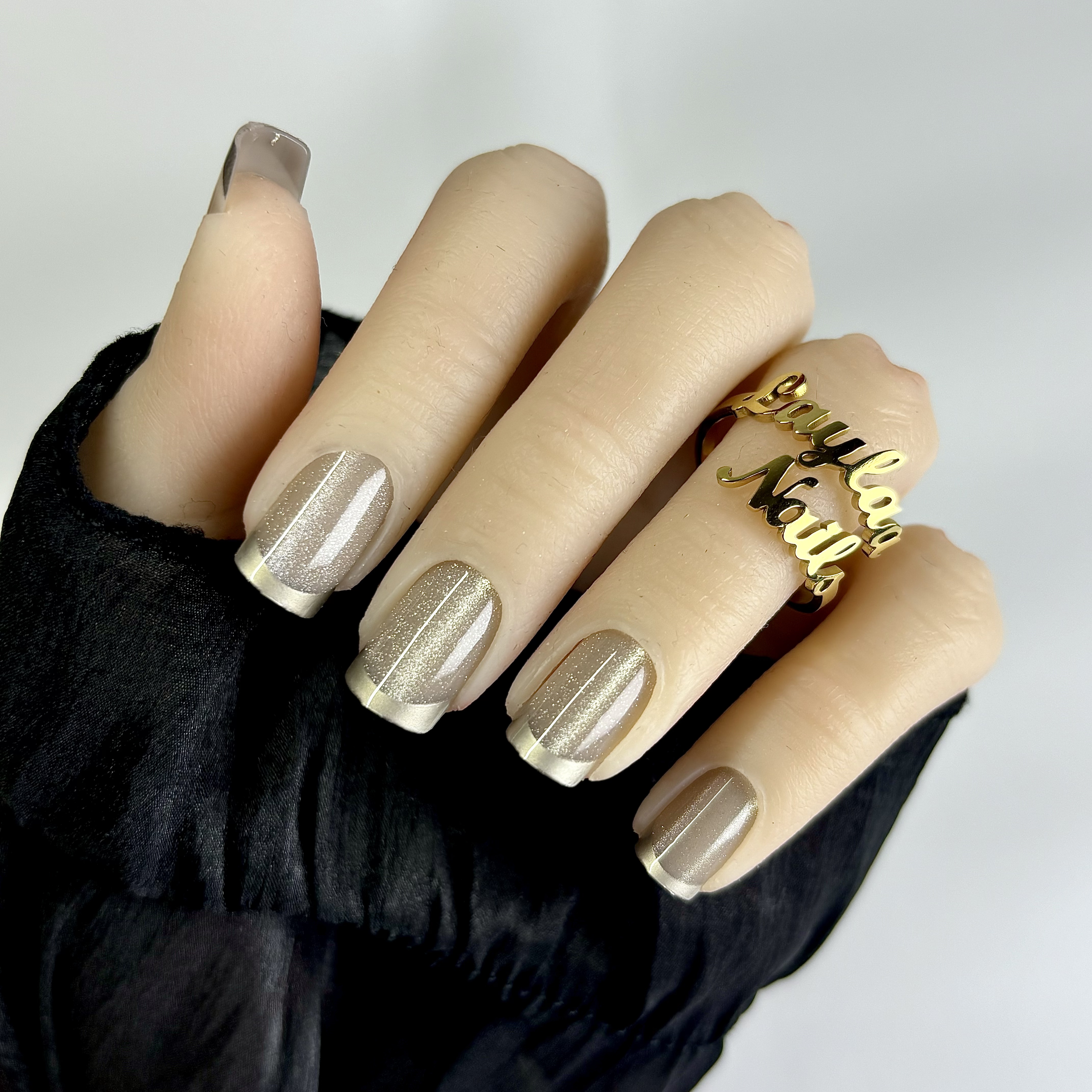 Golden French tips cat eyes short nails