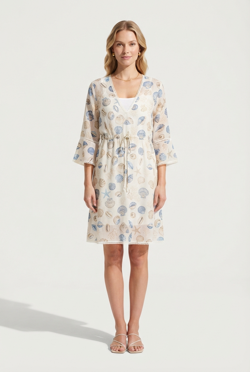 Seashell-toned resort cover-up dress with flowing Mediterranean silhouette