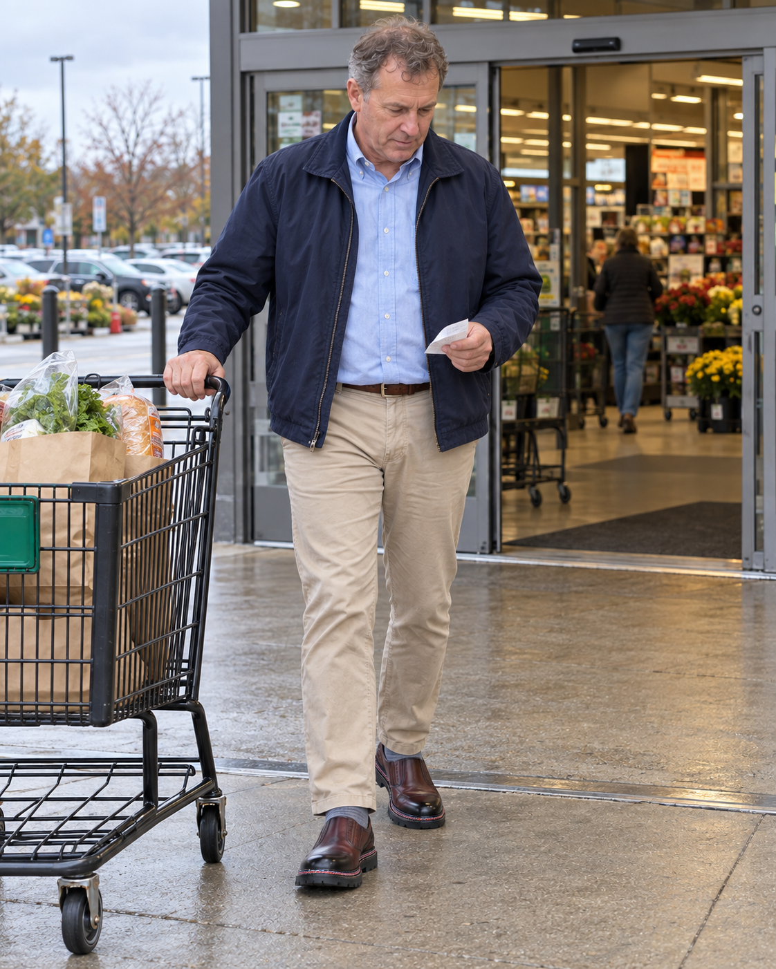 Man wearing StepReady Forge loafers while shopping for groceries