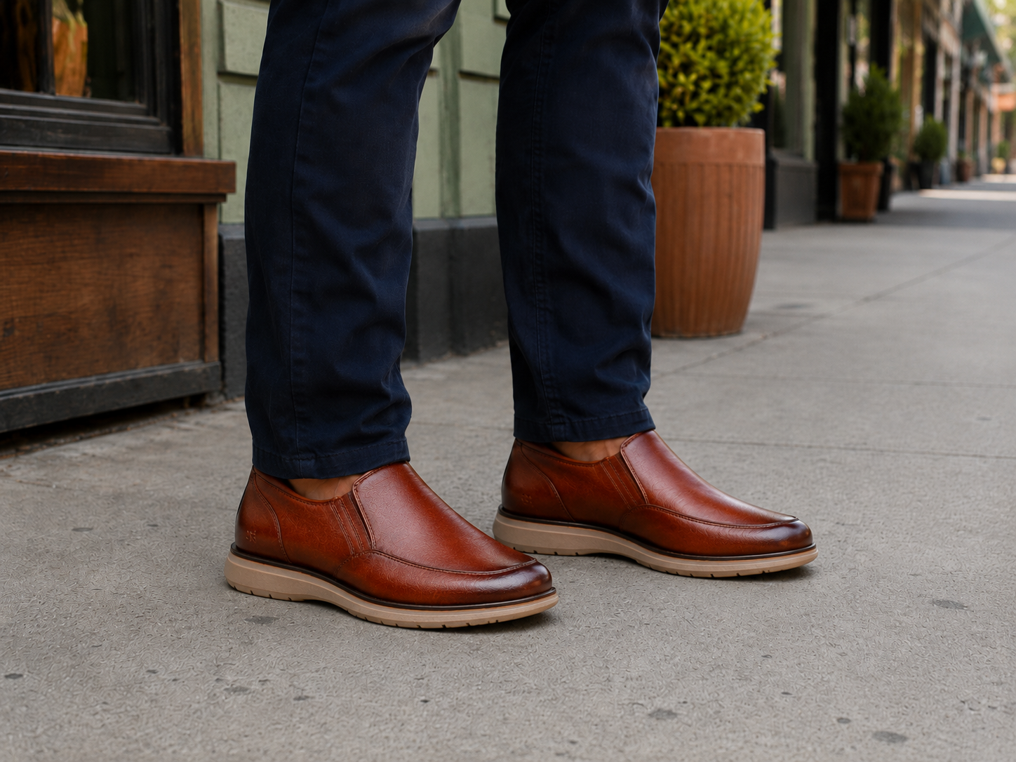 Mature man standing outside wearing StepReady brown leather loafers for errands