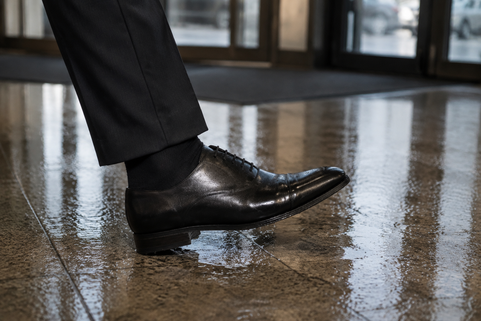 Traditional dress shoe with questionable grip on wet polished floor