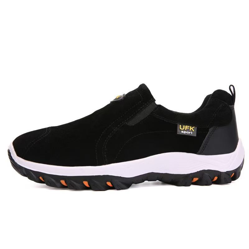 Black outdoor-style slip-on shoe with elastic side panels and white midsole