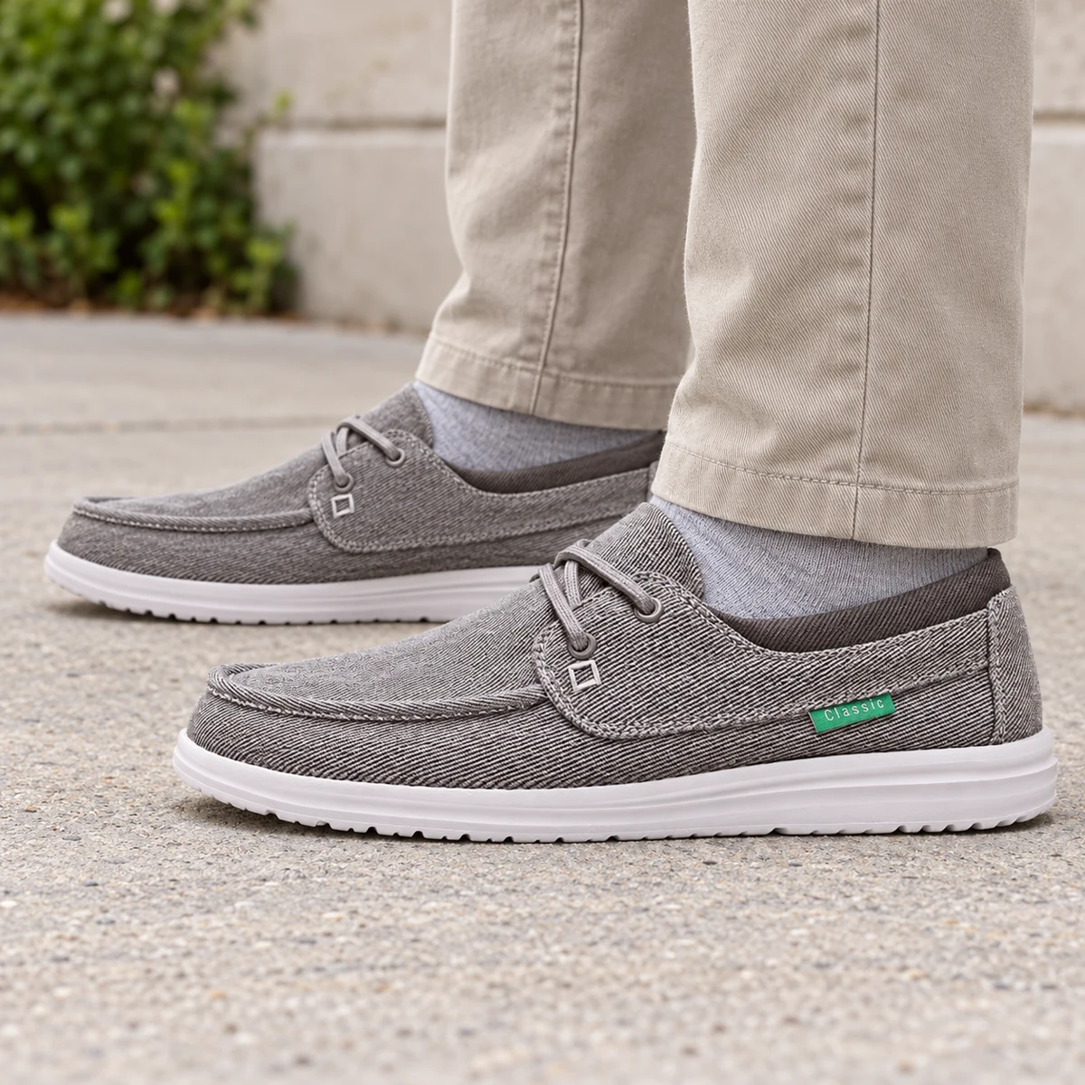 Gray canvas boat-style shoes with straight-leg trousers
