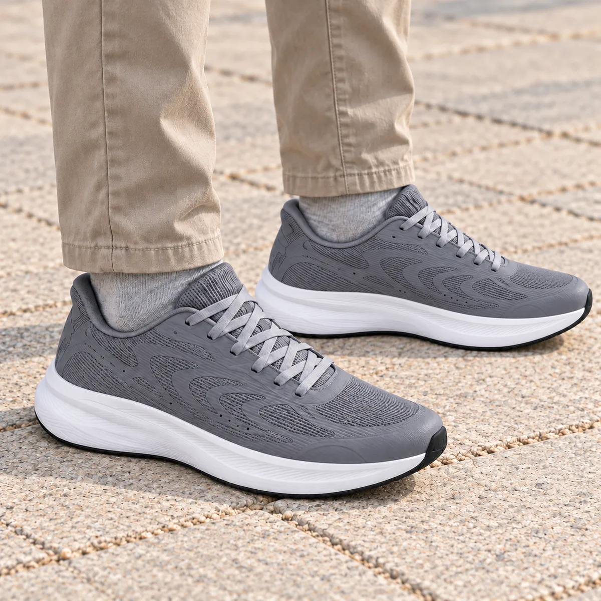 Light grey mesh shoes worn naturally with straight-leg trousers